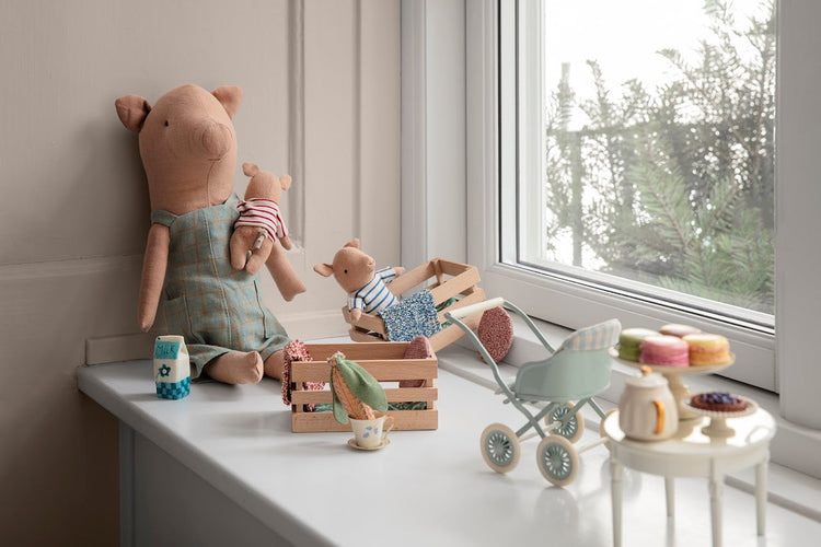 Discover the cuddly Maileg Baby Boy Pig in Box, the perfect companion for imaginative play in your dollhouse